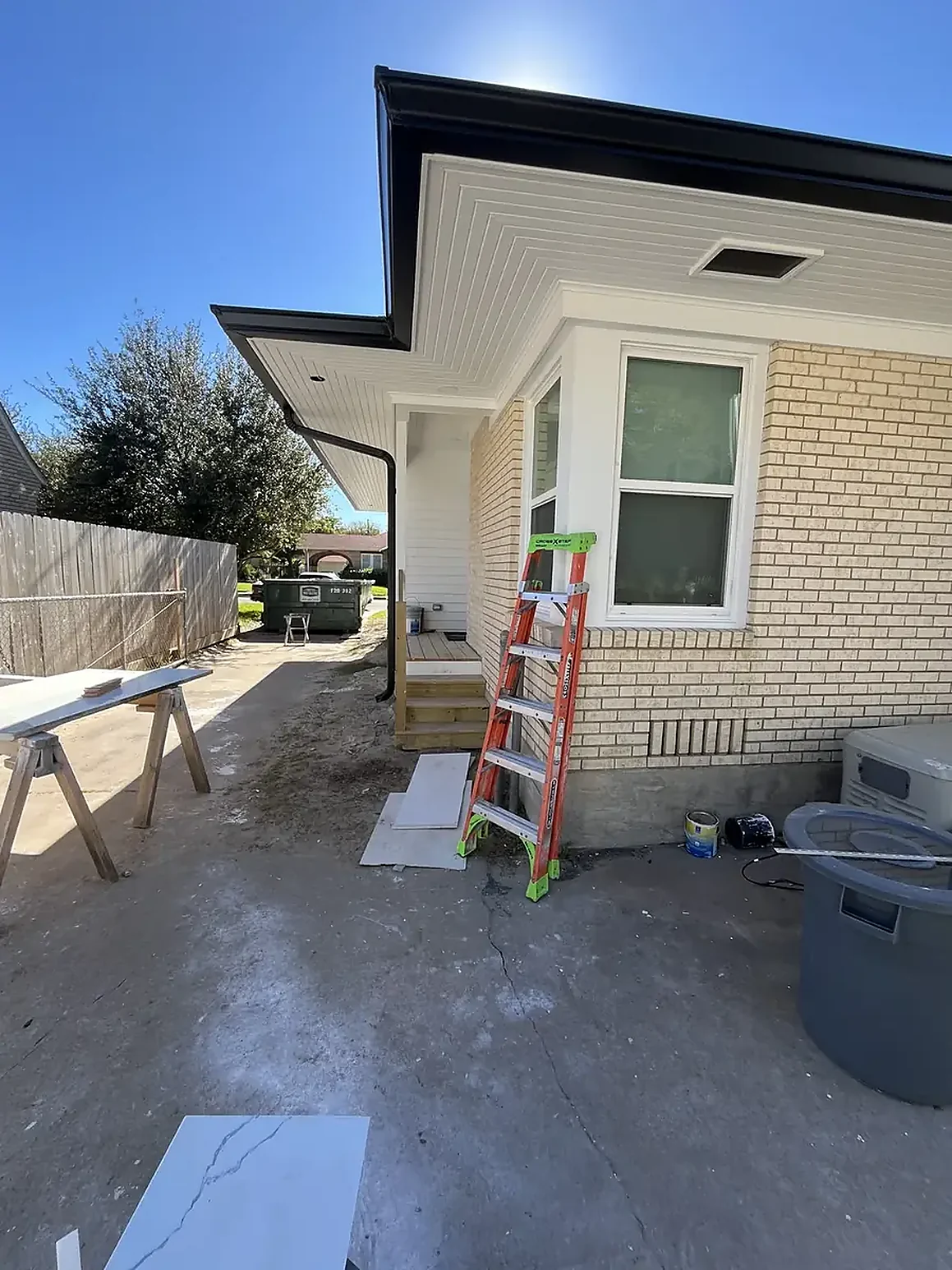 Downspout route beside a home exterior