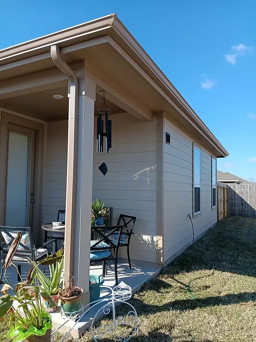 Porch corner with downspout and roof-edge detail