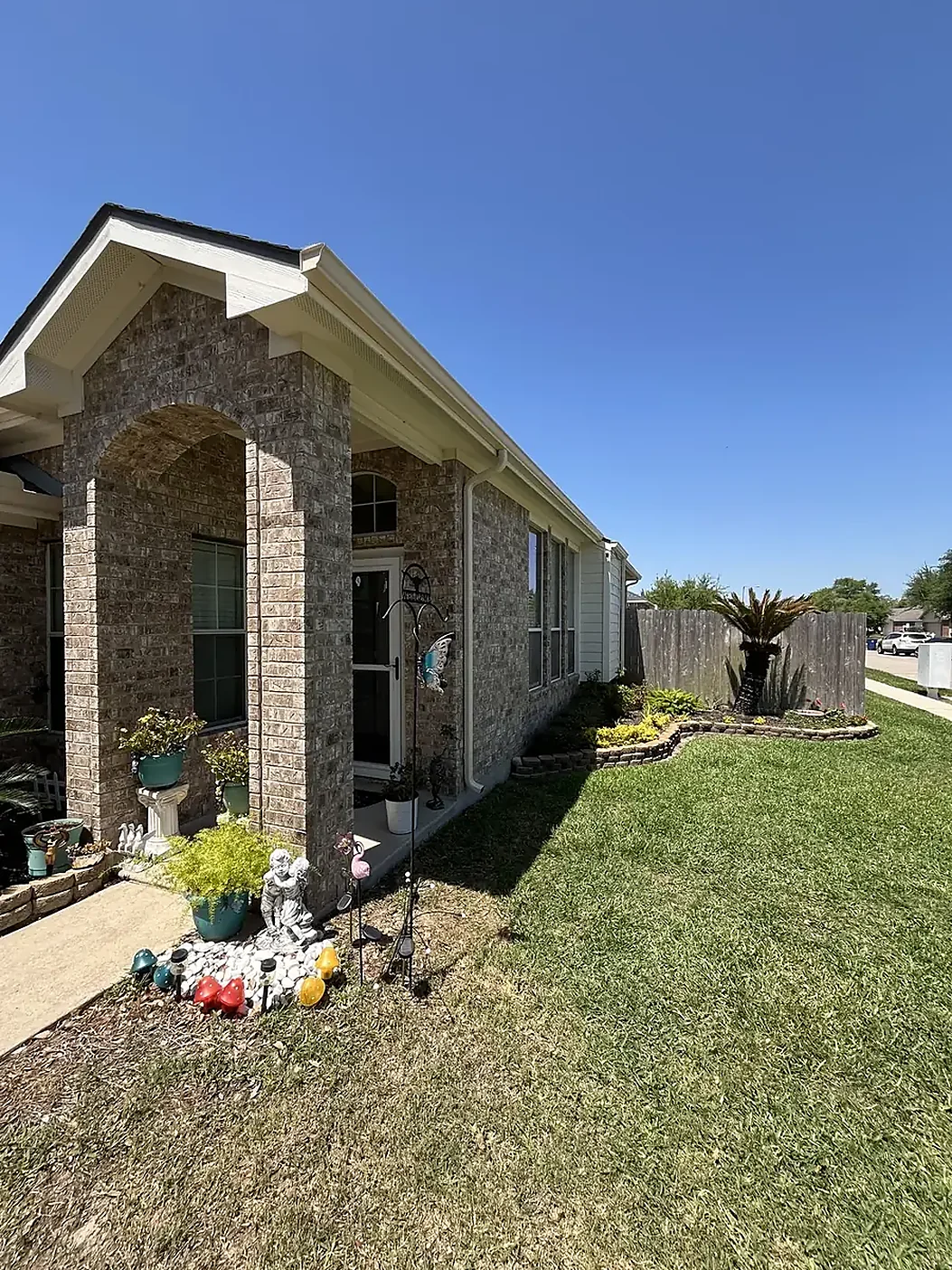 Front walkway and roofline with visible gutter planning