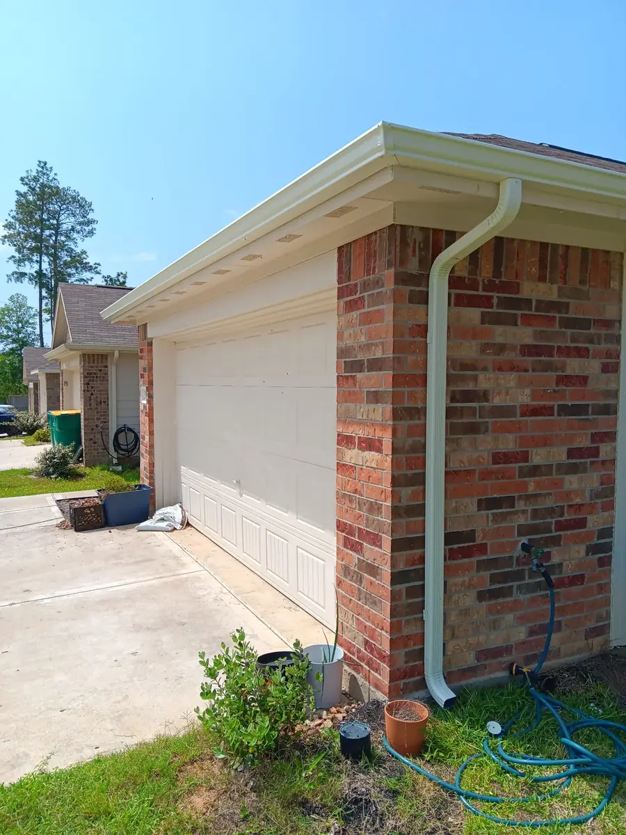Brick corner with a light gutter and downspout