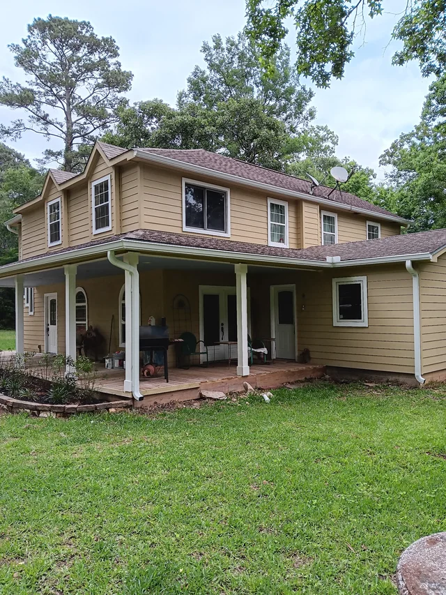 Gutters stepping around a two-story exterior