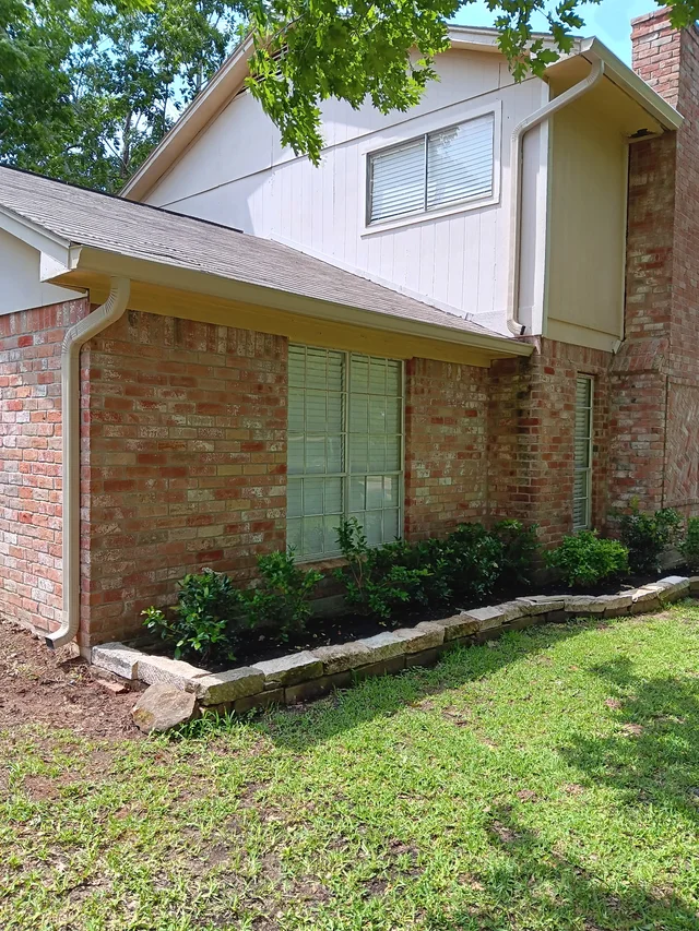 Gutters stepping around a two-story exterior