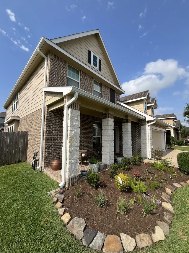 Gutters stepping around a two-story exterior