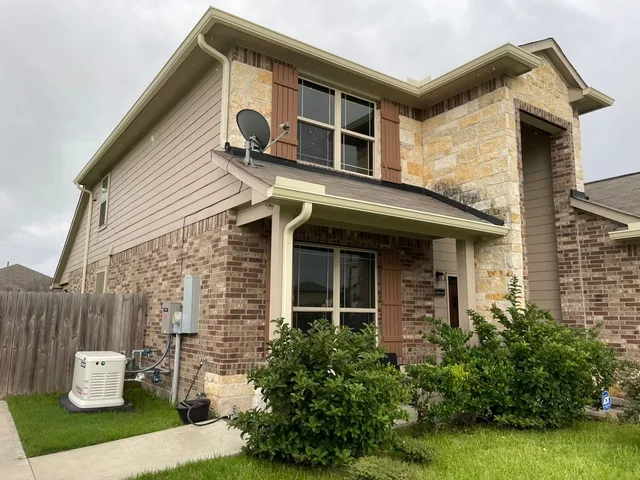 Gutters stepping around a two-story exterior