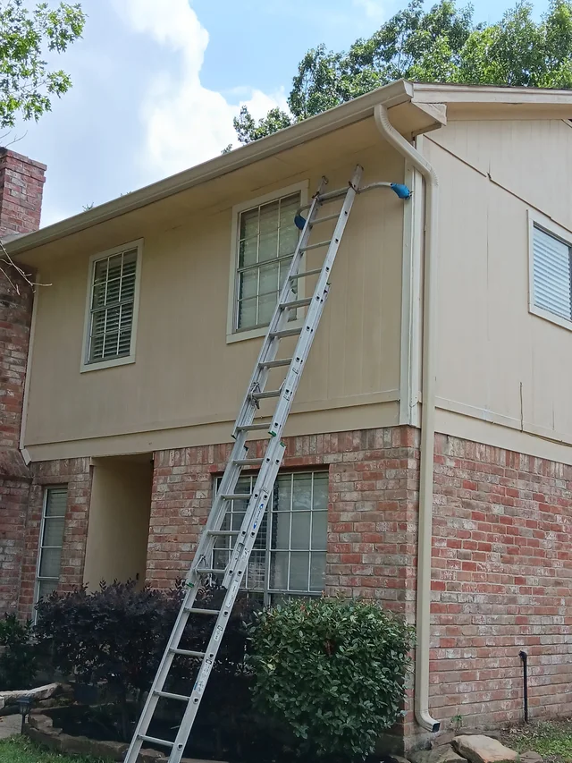Gutters stepping around a two-story exterior