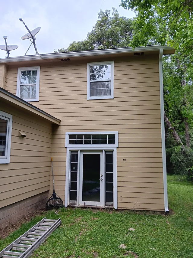 Gutters stepping around a two-story exterior