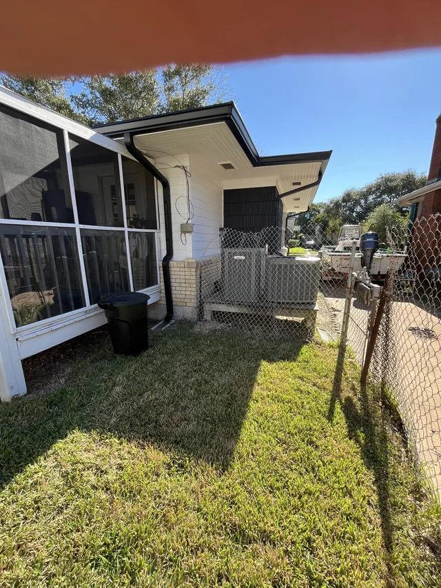 Gutter line beside a screened outdoor living area