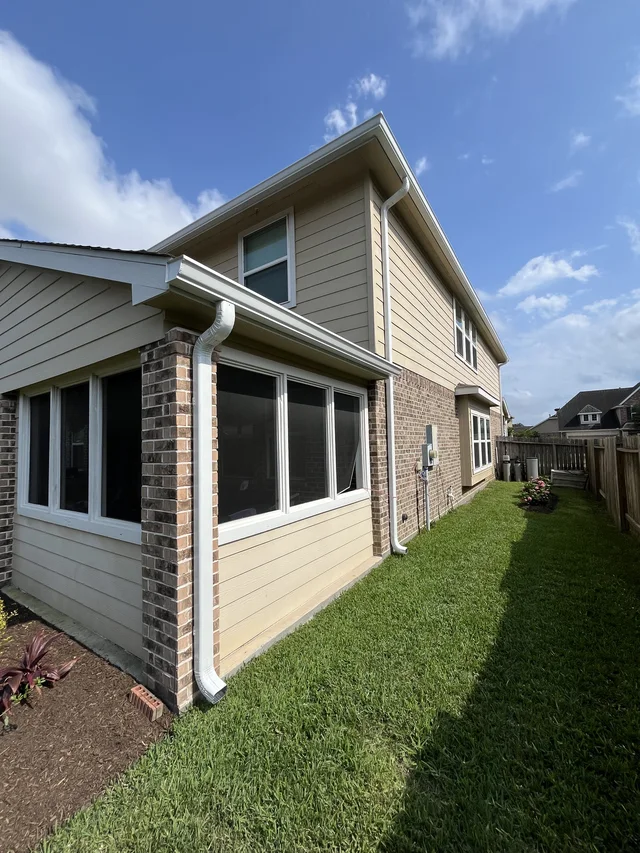 Gutters stepping around a two-story exterior