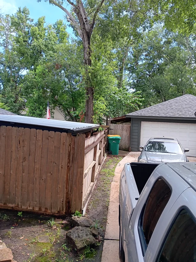 Dark gutters and downspouts around a brick exterior