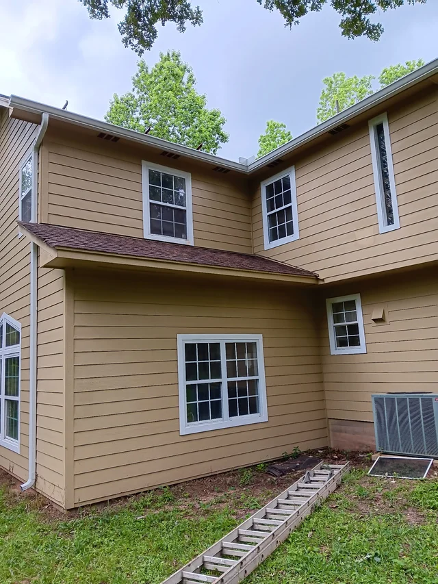 Gutters stepping around a two-story exterior