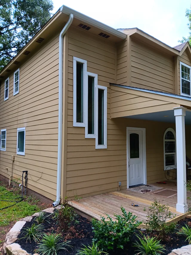 Gutters stepping around a two-story exterior