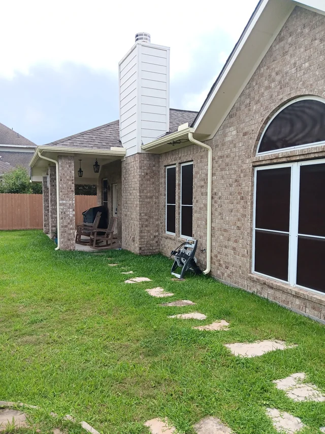 Gutters stepping around a two-story exterior
