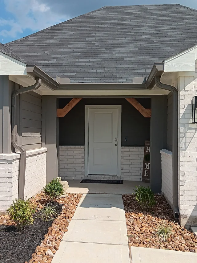 Gutters stepping around a two-story exterior