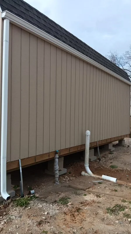 Roofline and downspouts on a metal-sided building