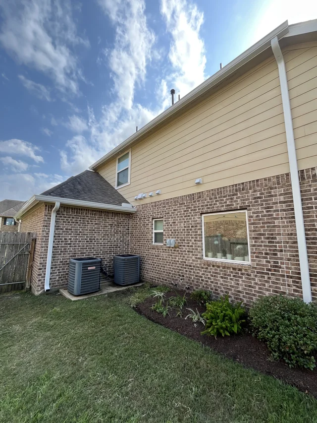 Gutters stepping around a two-story exterior